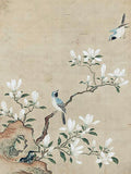 A small bird above white magnolia blossoms on aged silk