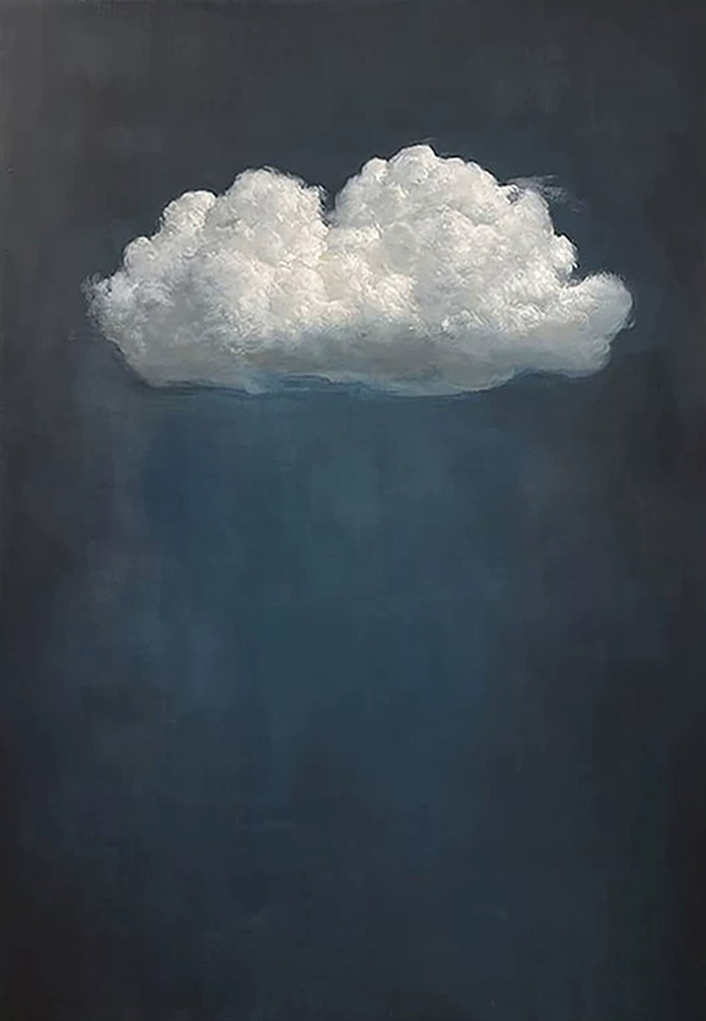 A single white cloud floating in a deep navy sky