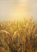 Ripe wheat ears glowing under a soft golden sky