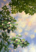 Lily pads and pink blossoms floating on water that mirrors leafy branches and a lilac sky