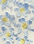 Sculpted pale blue petals scattered with gold on white