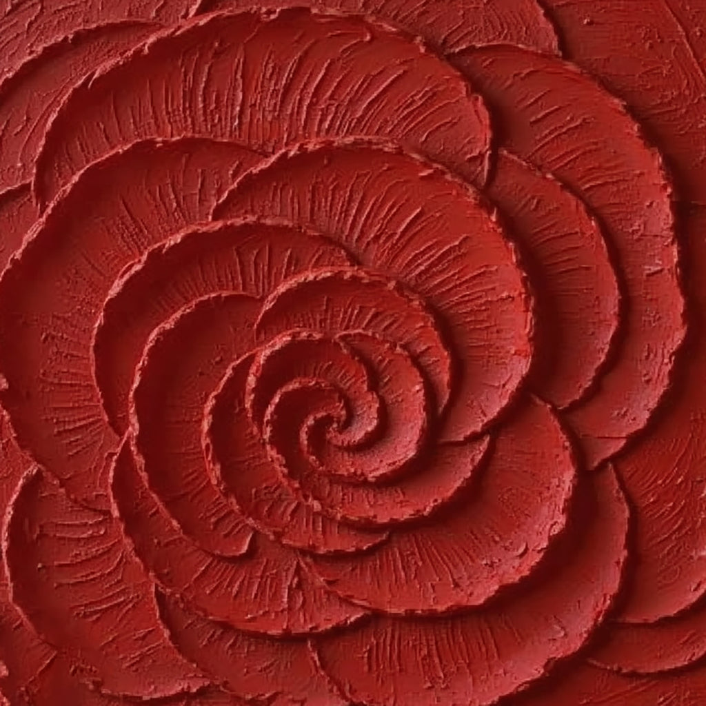 A huge spiralling rose carved in deep crimson paint