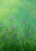 Small violet irises in tall grass against a soft green glow