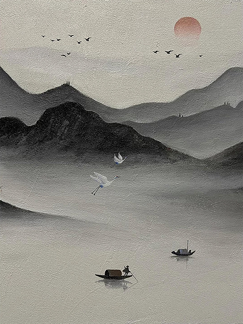 Misty ink mountains, cranes and small boats beneath a red sun