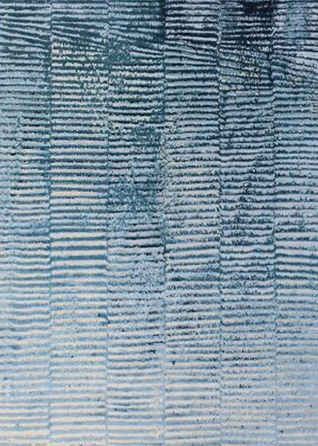 Rows of fine wave-like ridges in denim, sky and white, like windblown water
