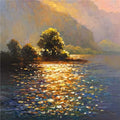 A wooded island glowing in sunset light above a shimmering lake