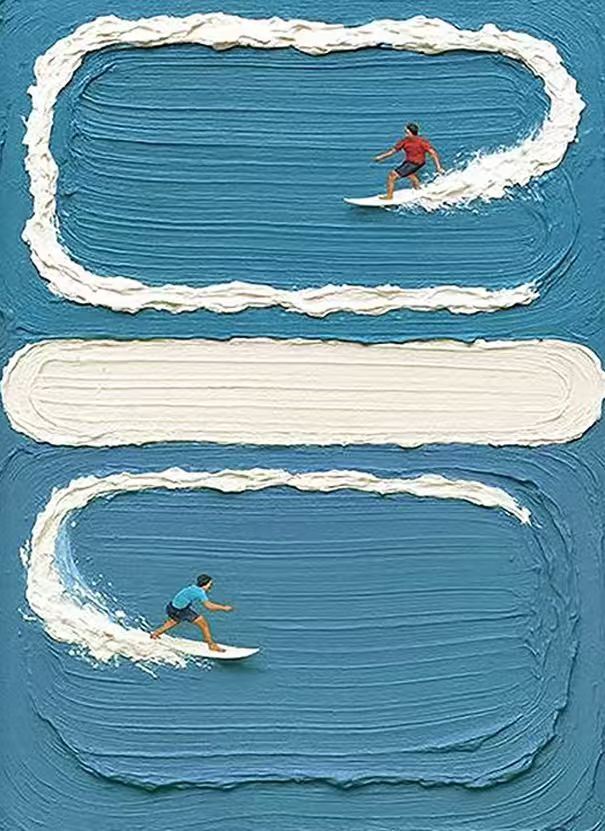 Two tiny surfers carving loops of sculpted white foam on deep blue