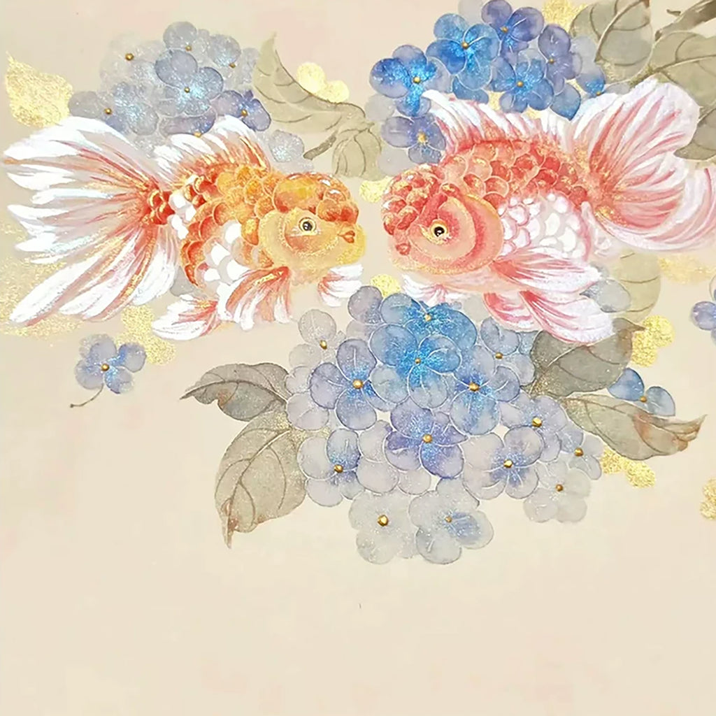 Two orange goldfish among clouds of blue hydrangea