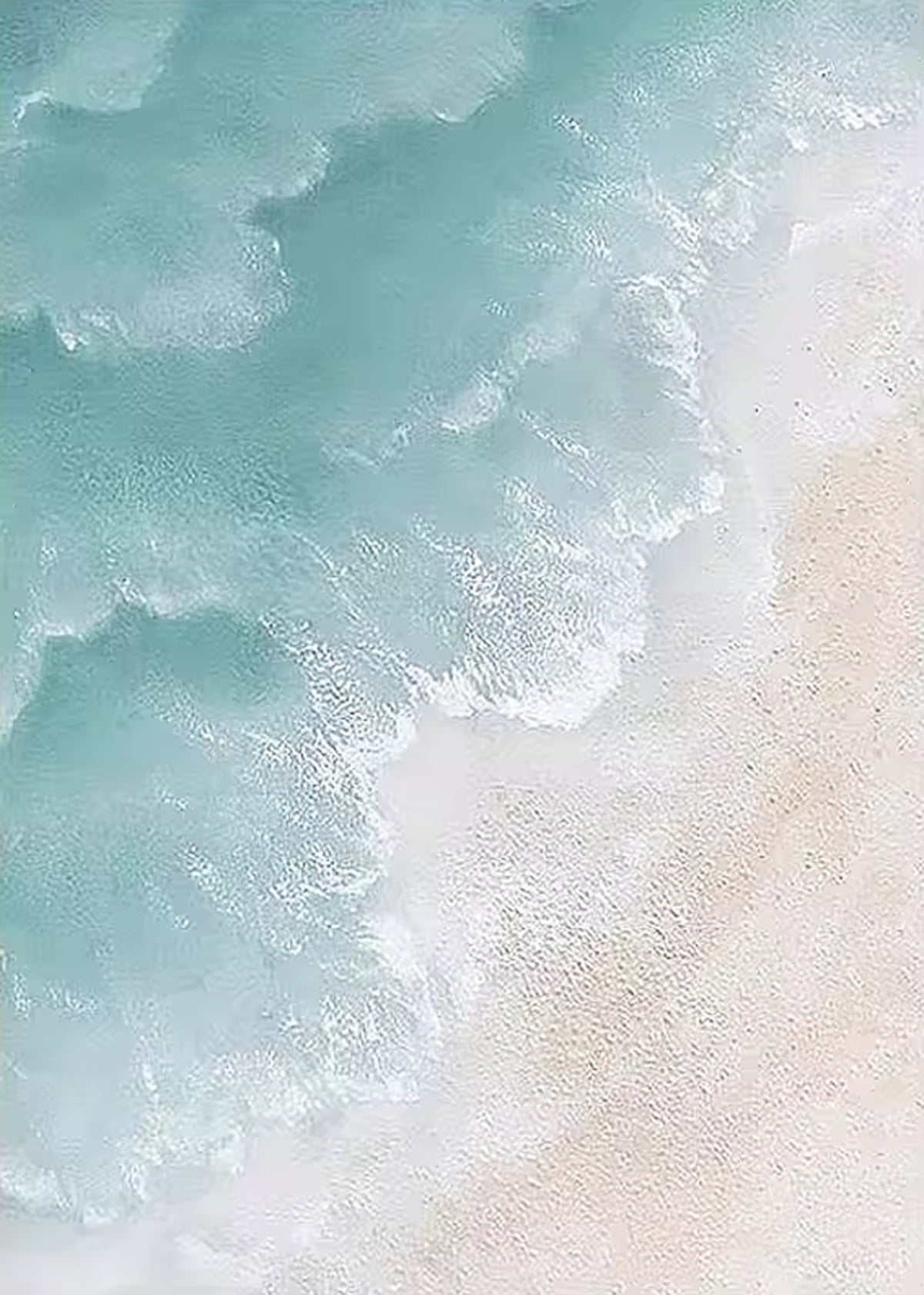 Foamy turquoise waves rolling onto pale sand, seen from above