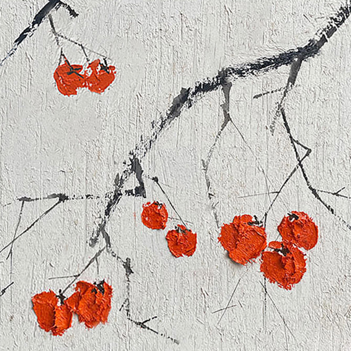 Bright red berries on dark ink branches over a rough white textured ground