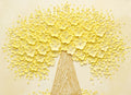 A tree crowned in sculpted pale-yellow blossoms on a soft cream ground