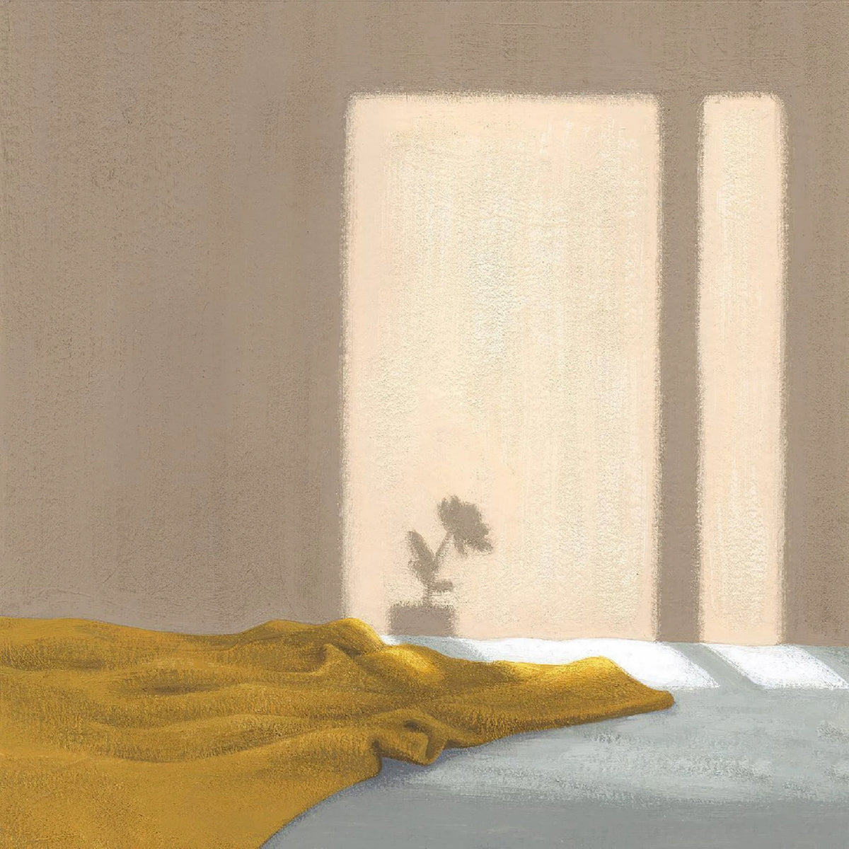 Soft window light falling on a beige wall above a mustard throw