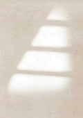 Soft bars of window light stepping across a pale speckled wall