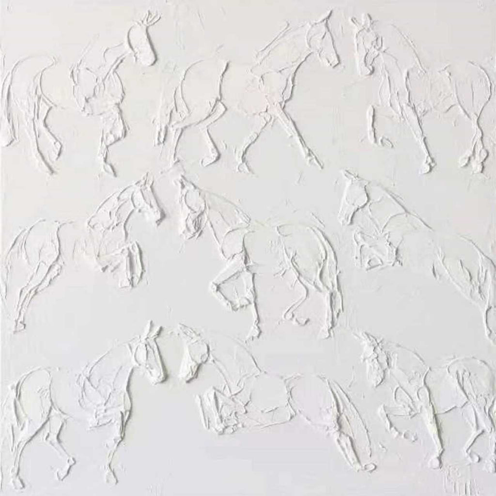 A herd of galloping horses sculpted in white plaster-like relief