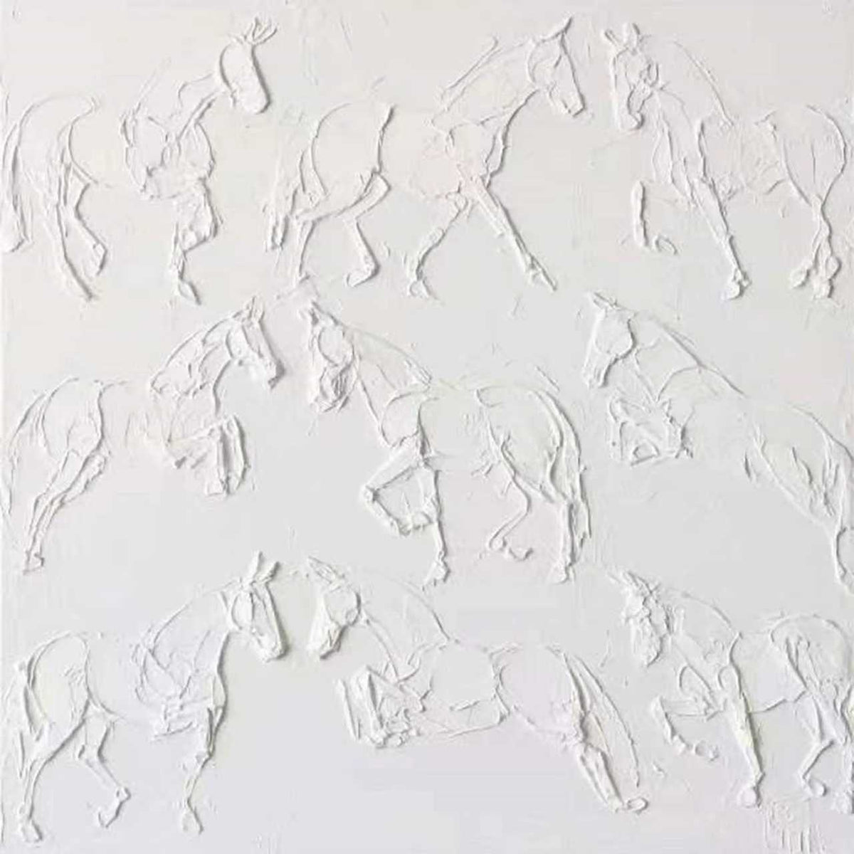 A herd of galloping horses sculpted in white plaster-like relief