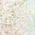 A dense haze of pink, white and mint blossoms in soft impressionist dabs