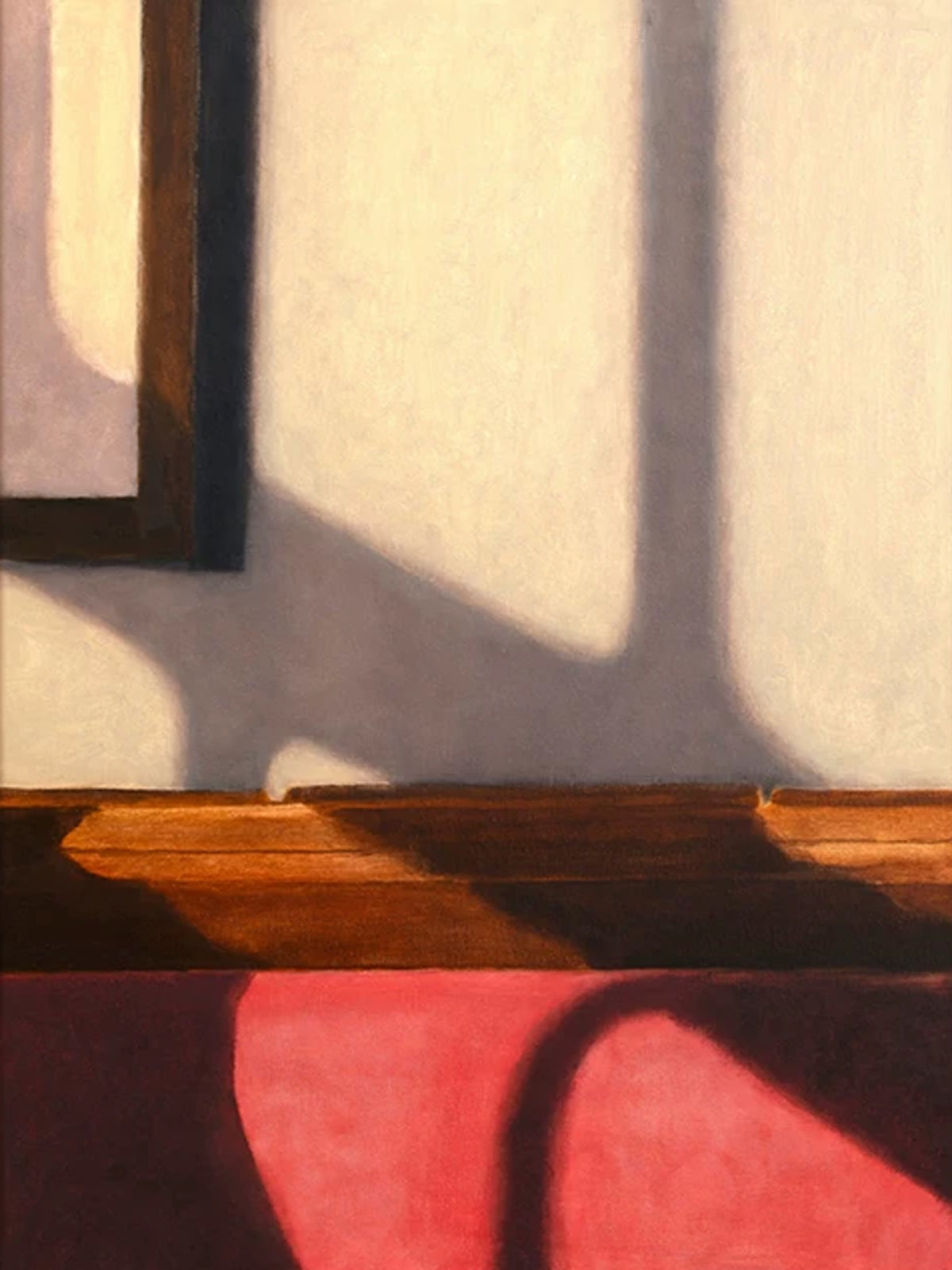 A window's shadow stretching across a pale wall above a wooden bench and a pink cushion