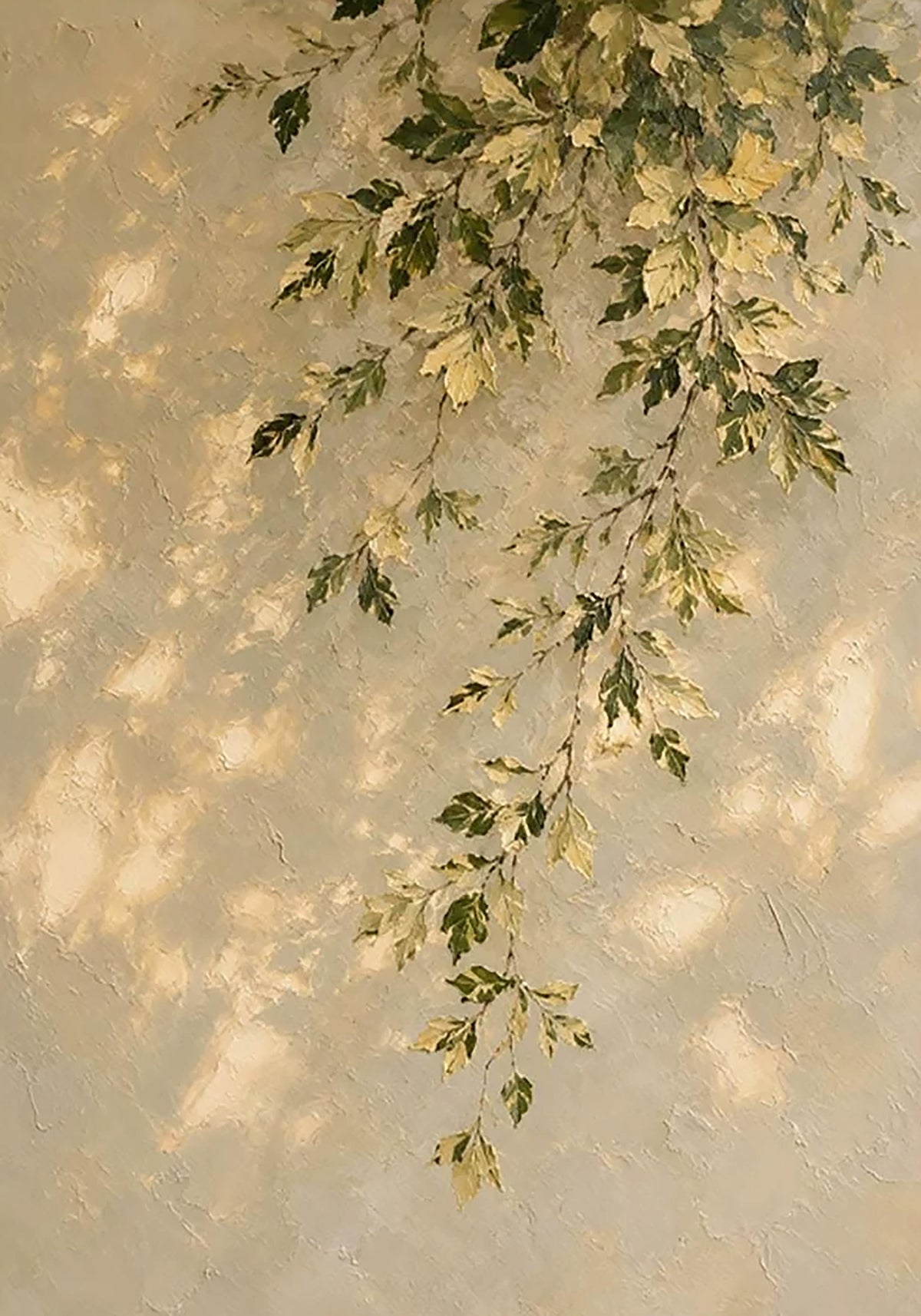 A spray of green and gold leaves hanging down a sunlit textured stucco wall