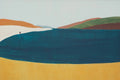 A deep teal lake among rolling hills of orange, green and mustard, one tiny figure on the shore