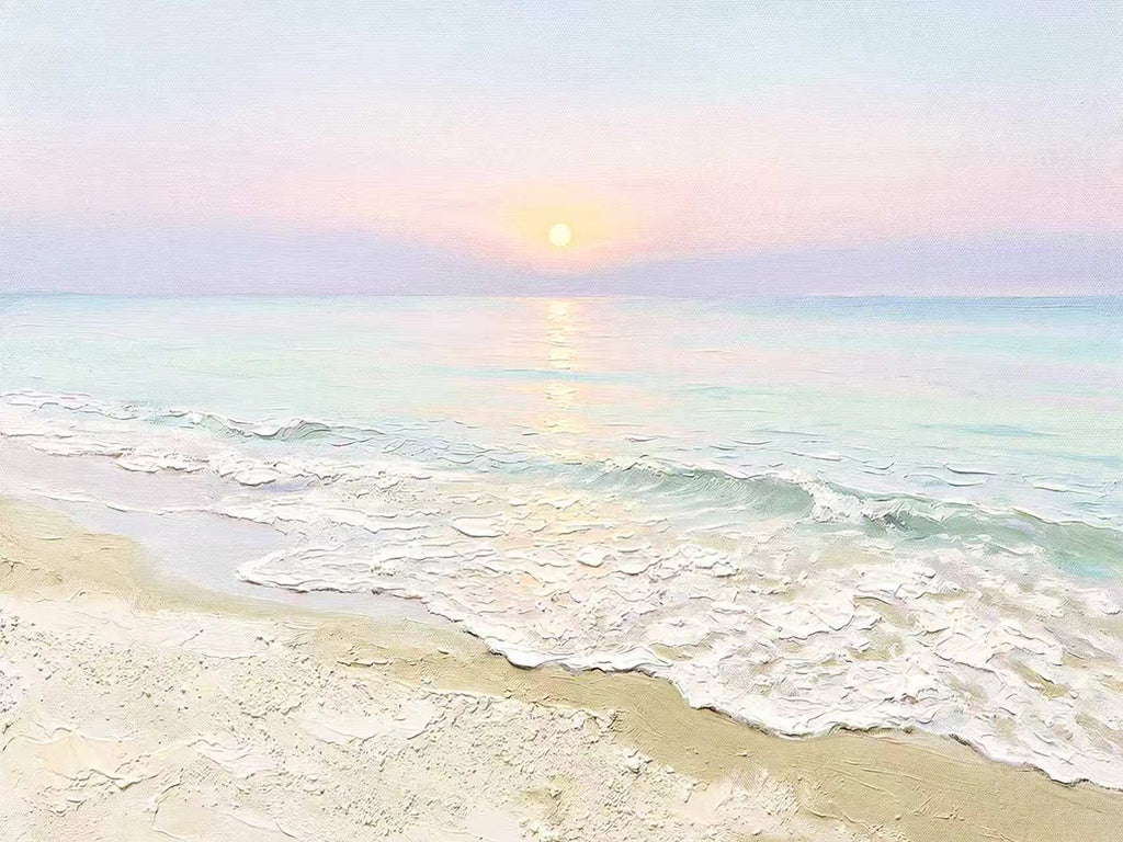 Soft foamy waves rolling onto a pale beach under a pink and lilac dawn