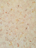 A field of tiny raised petals in cream, peach and gold scattered over a soft yellow ground