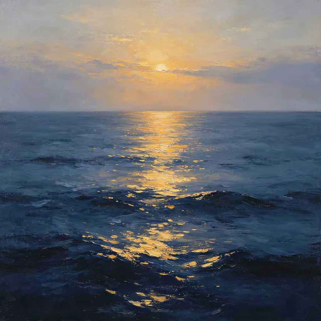 A golden sunset path stretching across deep blue evening waves