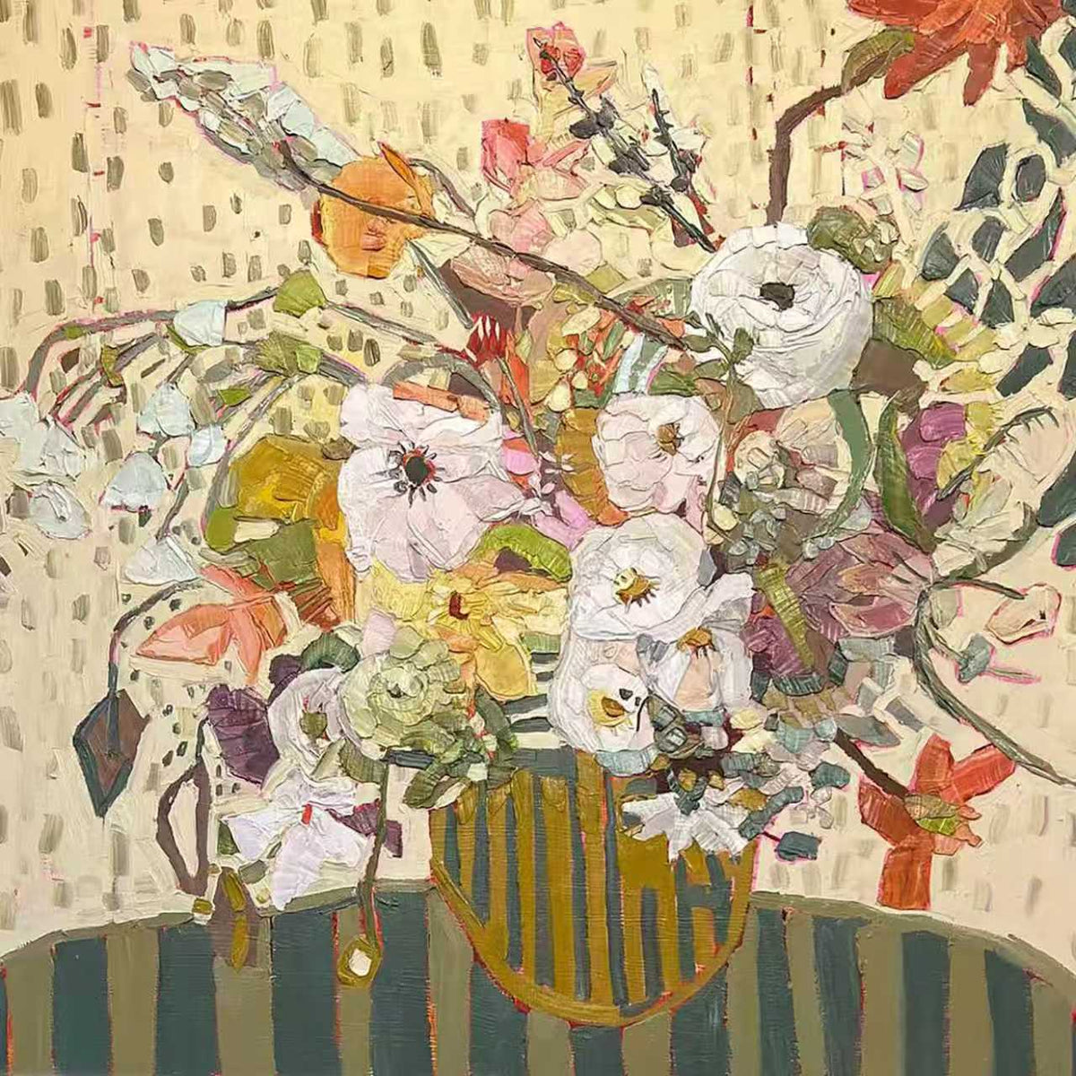 A loose wild bouquet of white, coral and lilac flowers in a striped vase against a dotted cream wall