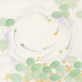 Pale silver fish circling among mint lily pads and small gold coins on cream