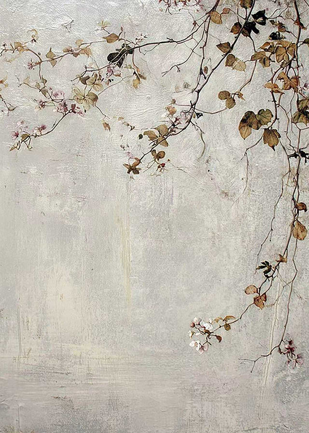 Thin branches with pale blossoms and russet leaves trailing over a weathered grey plaster wall