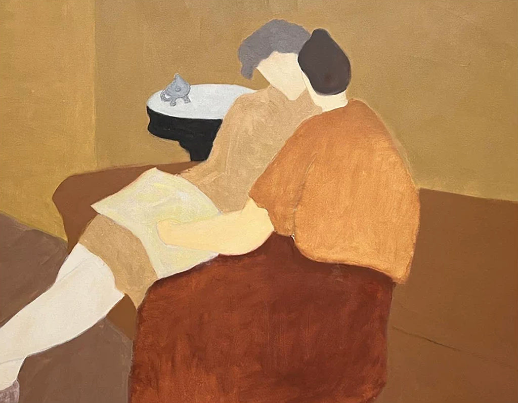 Two figures in rust and ochre embracing on a sofa beside a small table with a teapot