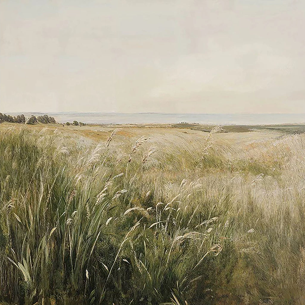 Tall wind-blown grasses on the dunes above a pale, quiet sea