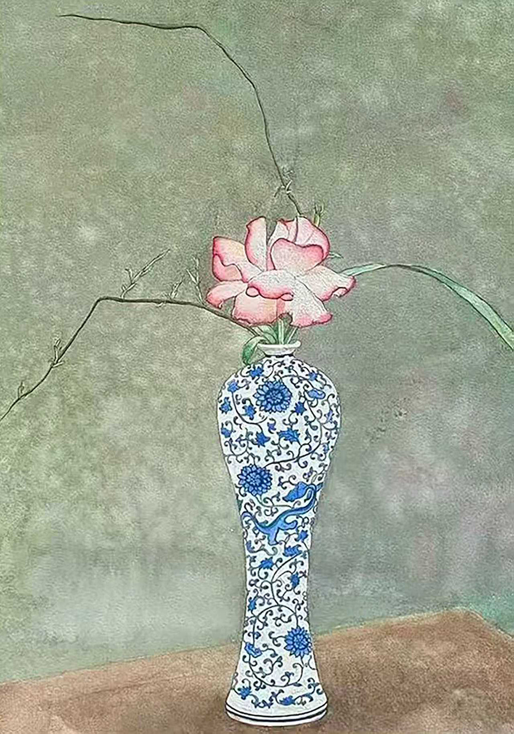 A single pink rose and a sweeping branch in a slender blue-and-white porcelain vase