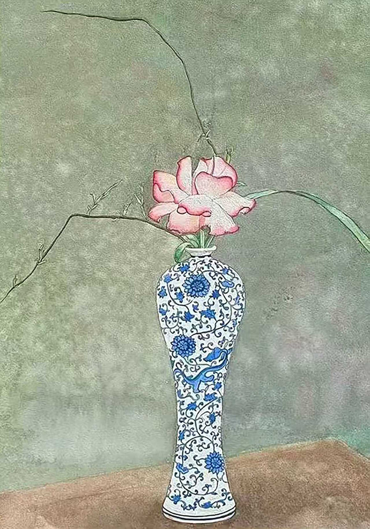 A single pink rose and a sweeping branch in a slender blue-and-white porcelain vase
