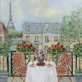 A table set with champagne and strawberries on a geranium-lined balcony, the Eiffel Tower beyond