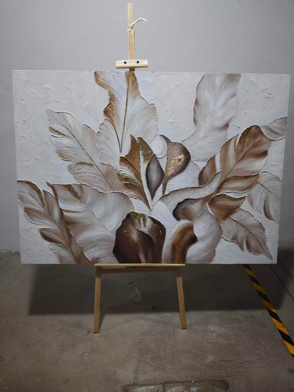 Sculpted leaves in shimmering silver and grey tones.