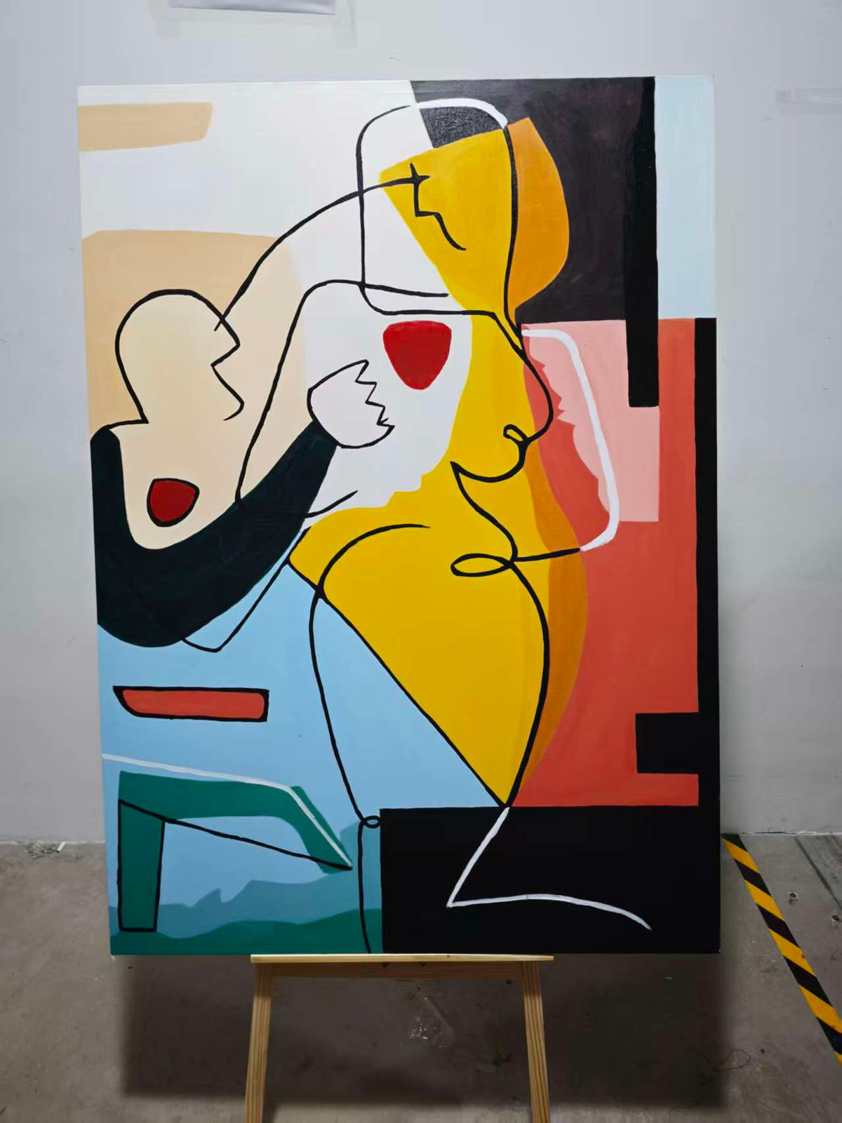 Abstract figures in black line with blocks of yellow, blue and rust.