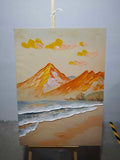 Golden mountains with drifting clouds above a pale sea.