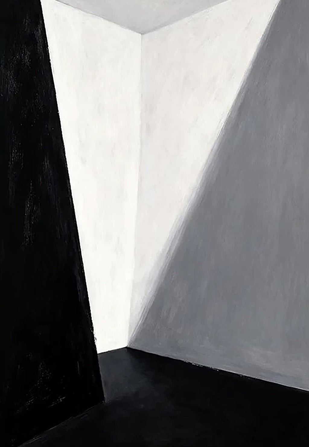 A bare corner of white walls cut by a sharp diagonal shadow