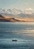 A small boat crossing a shimmering lake below snow-capped mountains and golden hills