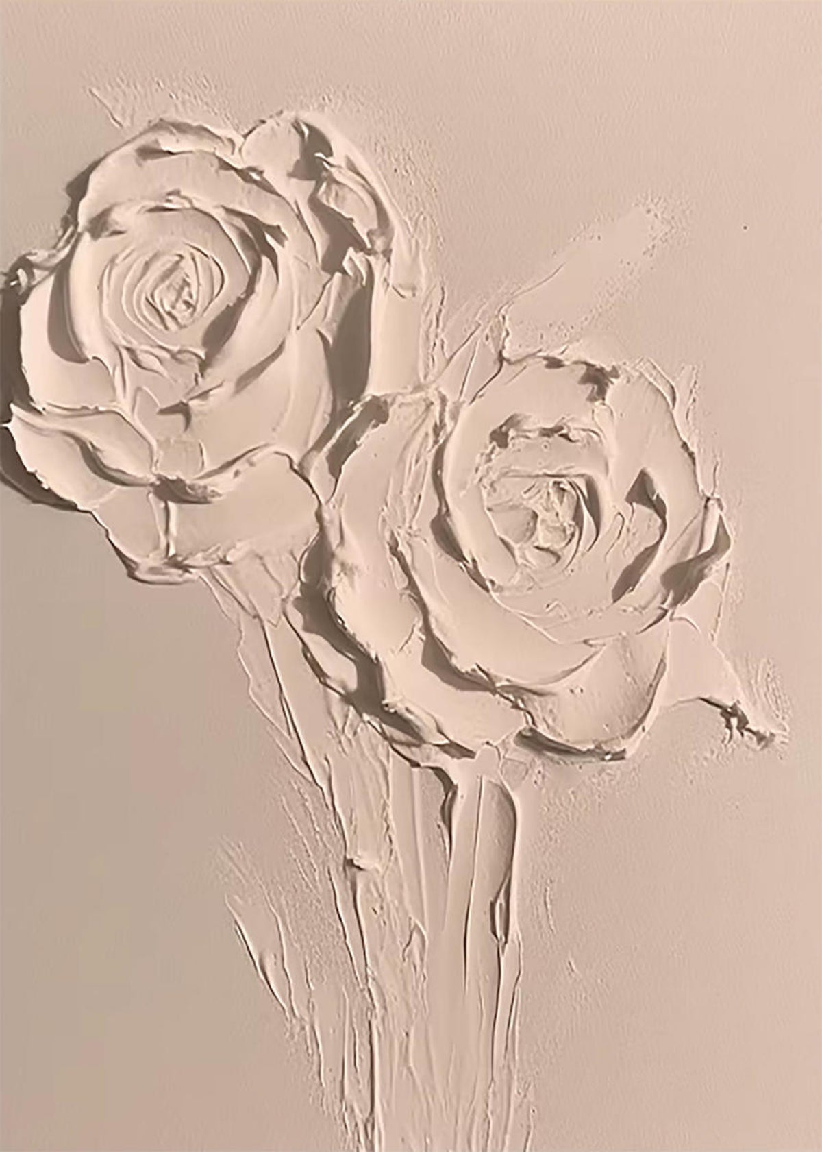 Two roses sculpted in thick white plaster-like paint on a warm cream ground