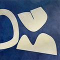 Cream organic cut-out shapes on a deep navy ground