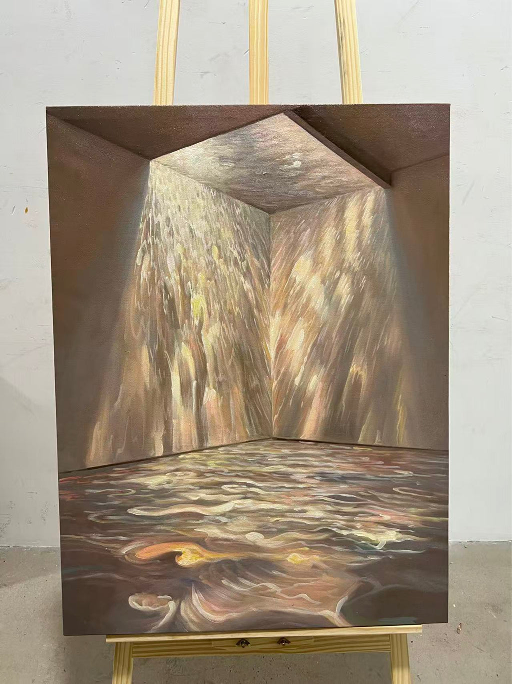 Sunlight pouring through a doorway onto rippling water across a floor.