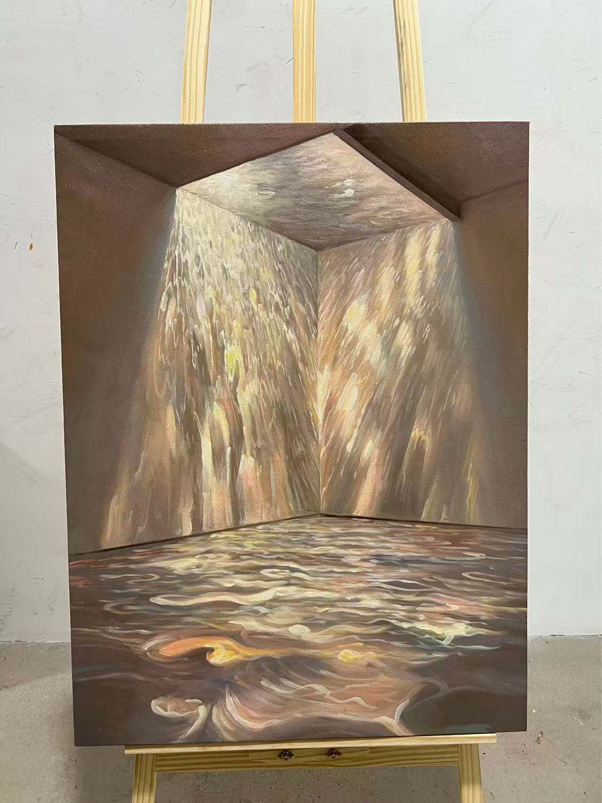 Sunlight pouring through a doorway onto rippling water across a floor.