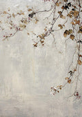 A delicate branch of small blossoms and leaves trailing over a weathered pale grey wall