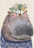 A gentle grey hippo wearing a crown of white wildflowers.