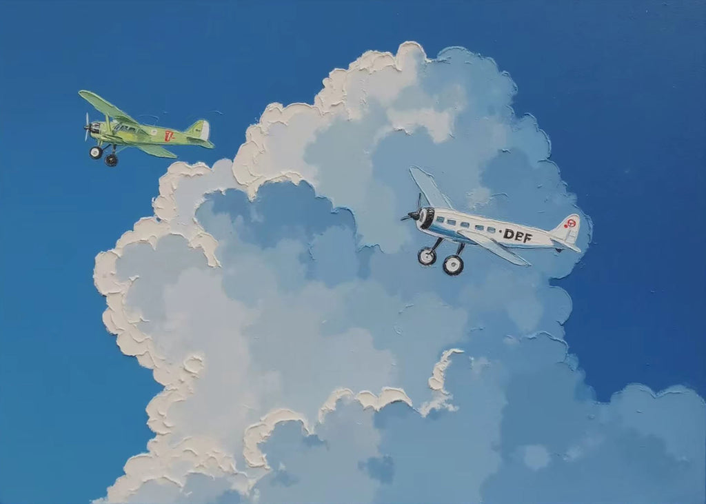 Two vintage biplanes drifting through towering white clouds in a bright blue sky.