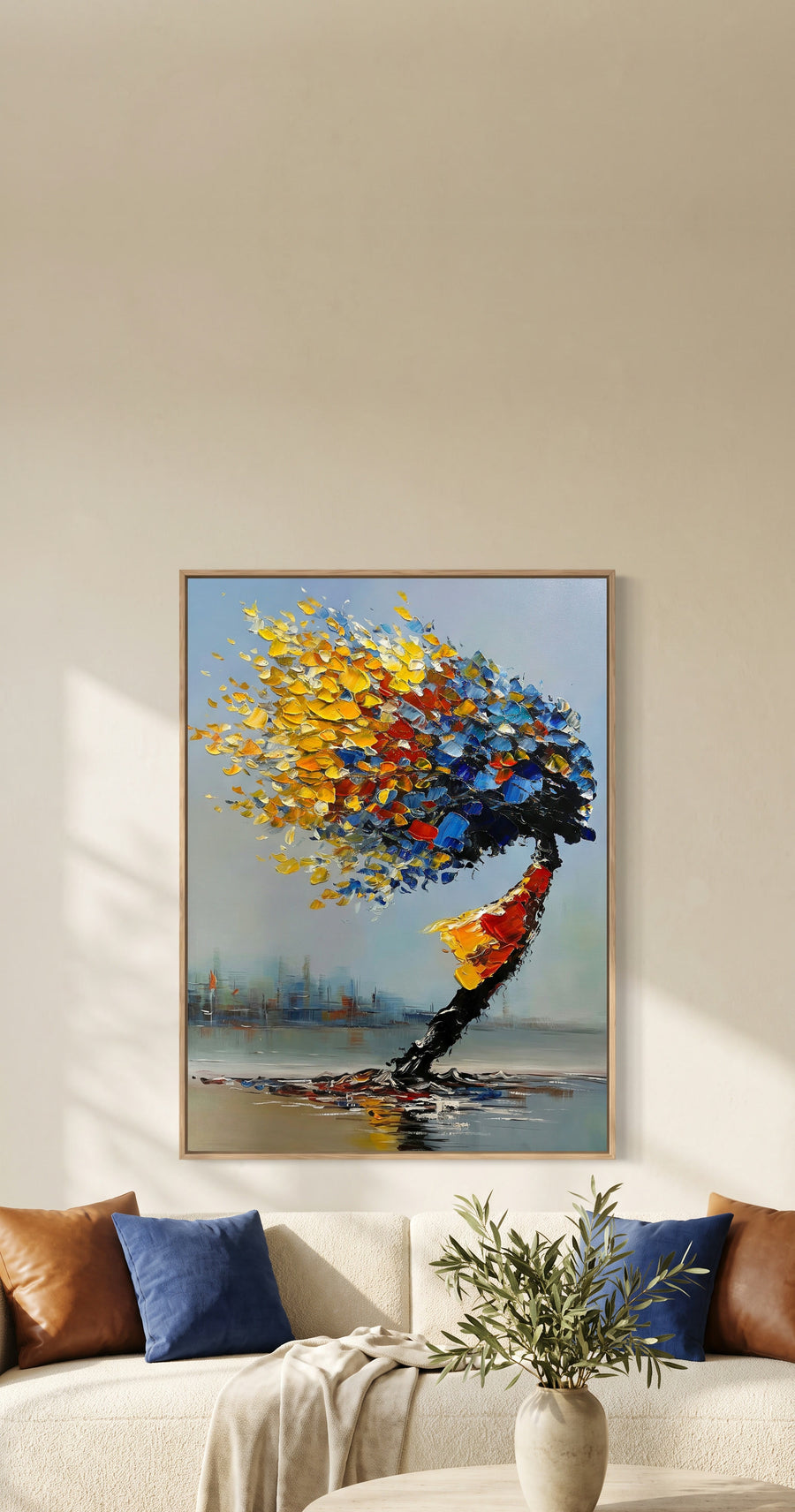 Mistral in Cobalt and Gold hanging above an ivory sofa in a sunlit living room